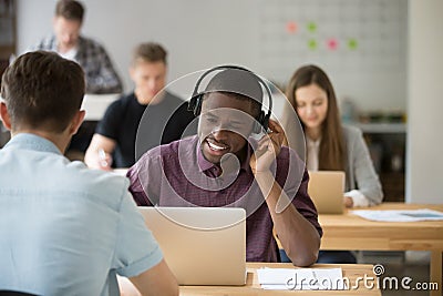 African american consulting client using wireless headset Stock Photo