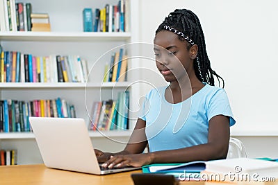African american young adult female student at computer Stock Photo