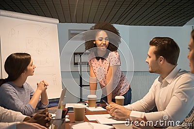 African american young project manager coach speaking at team meeting Stock Photo