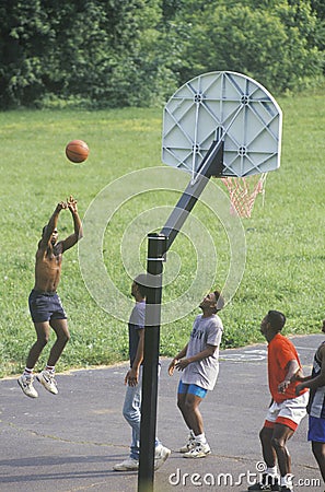 African-American youths playing street basketball, Editorial Stock Photo