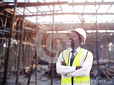 African architects engineer man with hardhat work together in the inside the construction building site.Engineering concepts Stock Photo
