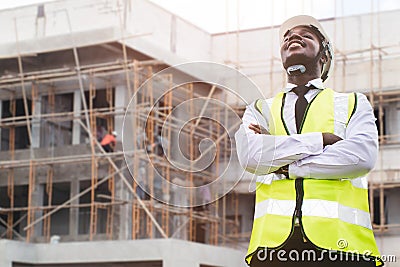 African architects engineer man in Protective clothing and helmet working near the construction building site Stock Photo