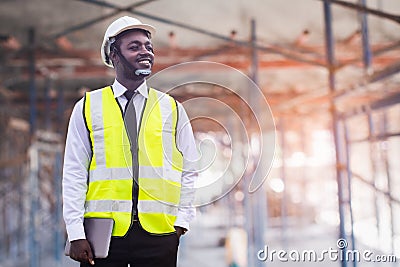 African architects engineer man with tablet work together in the inside the construction building site.Engineering concepts and Stock Photo