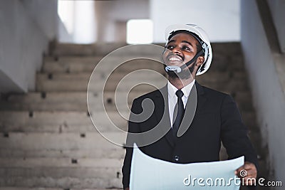 African architects engineer manager with tablet work together in the inside the construction building site Stock Photo