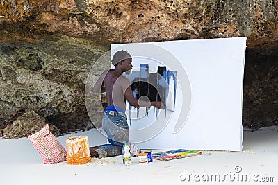 African artist man at work on the beach Editorial Stock Photo
