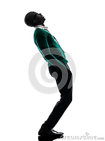 African black man standing looking up surprised silhouette Stock Photo