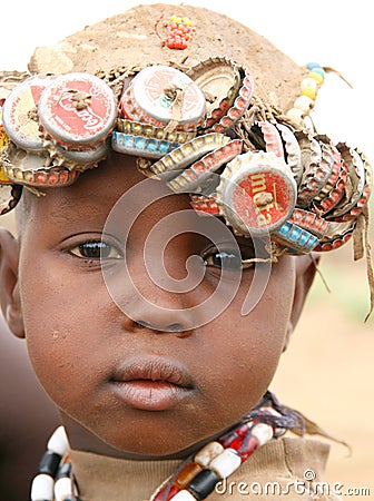 African boy wearing bottle caps Editorial Stock Photo
