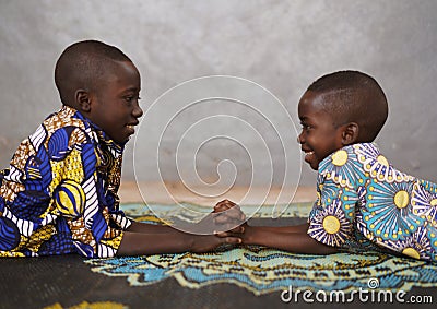 African boys children are Holding Hands and lots of Copy Space Stock Photo