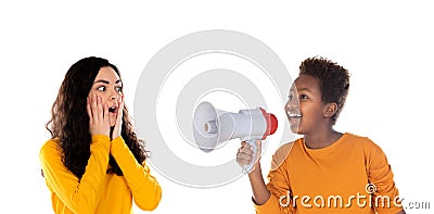 African child with a megaphone and a astonished teenager girl Stock Photo