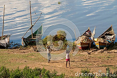 African children bring water from the lake Victoria Editorial Stock Photo