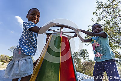 African children on merry-go-round Editorial Stock Photo