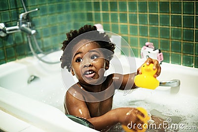 African descent kid enjoying bath tub Stock Photo