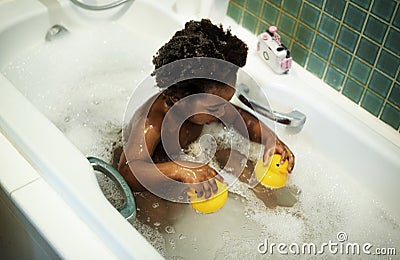 African descent kid enjoying bath tub Stock Photo