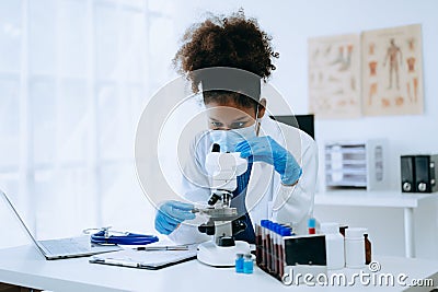 African doctor or consultant sitting at a desk writing sick note, surgery planning and prescription.and clinical report test Stock Photo