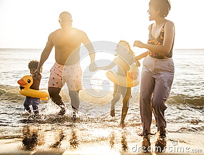 African family enjoying the beach Stock Photo