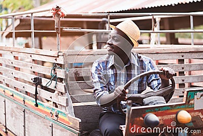 African farmer drive small tractor on the countryside Stock Photo