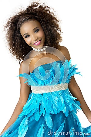 African Female Model Wearing Turquoise Feathered Dress, Big Afro Stock Photo