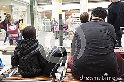 African-French people sitting and waitting train at Gare de Paris-Est Editorial Stock Photo