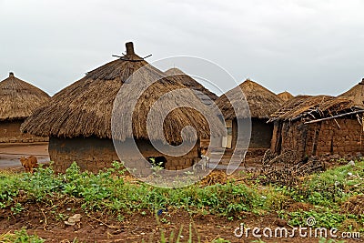 African Huts on a Rainy Day in Uganda Stock Photo