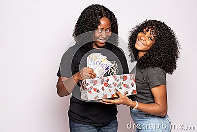 lady receives cash gift from a friend Stock Photo
