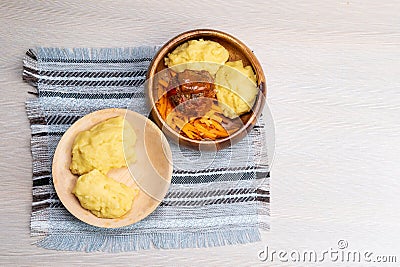African maize porridge called ugly in bowl. nshima, with meat and sweet potatoes. copyspace Stock Photo
