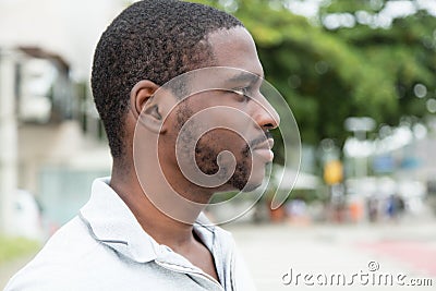 African man with beard looking sideways Stock Photo