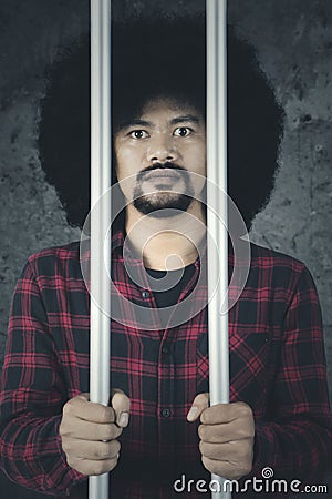 African man is behind a prison Stock Photo