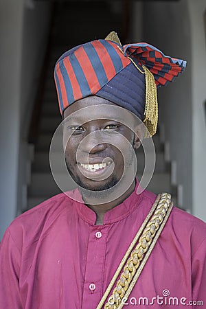 African man dressed in national clothes on a street in Stone Town on the island of Zanzibar, Tanzania, East Africa Editorial Stock Photo