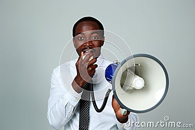 African man shouting through a megaphone Stock Photo