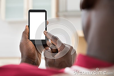 African Man Using Cellphone Stock Photo