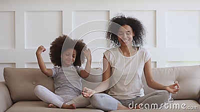 African Mom Teaching Funny Kid Daughter Meditate Together on Sofa Stock  Video - Video of feel, family: 212184425