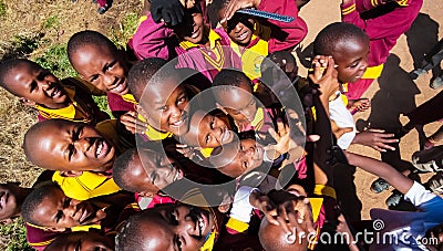 African Primary School Children on their lunch break Editorial Stock Photo