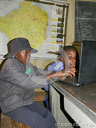 African primary schoolkids using laptop at school. Editorial Stock Photo