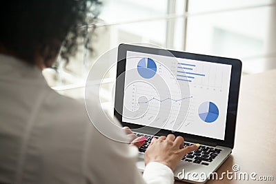 African project manager using computer software analyzing financ Stock Photo