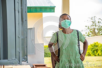 African school kid wearing a face mask Stock Photo
