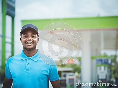 African service staff at the gas station are always ready to serve you with a smile and friendliness Stock Photo