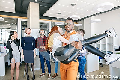 African student showing simpathy to redhaired female Stock Photo