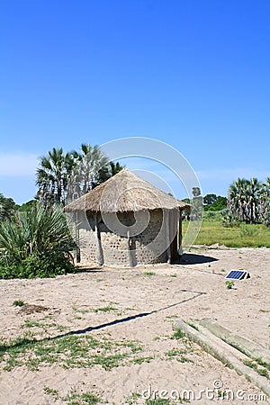 African Thatched Hut with Solar Panel in Northern Botswana Stock Photo