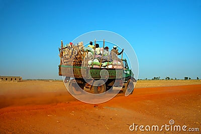 African truck with produce and people Stock Photo