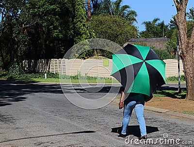 African woman with colorful umbrella Editorial Stock Photo