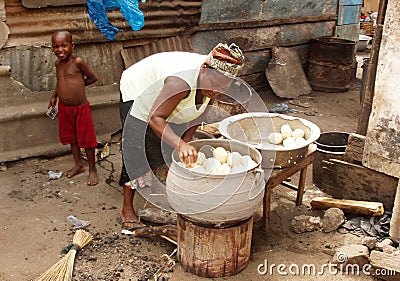 African woman cooking Editorial Stock Photo