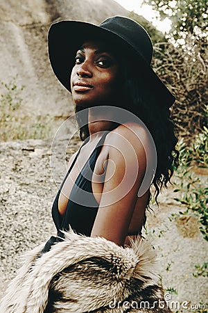 African woman, fashion and closeup with nature, portrait and beach for adventure. Tourist, clothes and holiday for Stock Photo