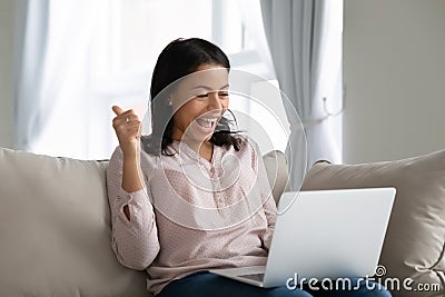 African woman using notebook feels happy showing thumbs up Stock Photo