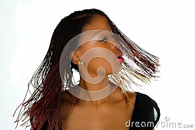 African woman swinging hair Stock Photo