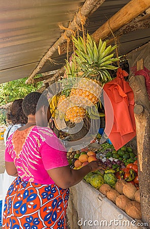 African women at Kenyan fruit and vegetable stand Editorial Stock Photo