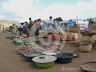 African women selling food on a dusty roadside Editorial Stock Photo
