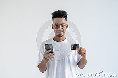 African young man making a payment using his mobile device isolated on white background Stock Photo