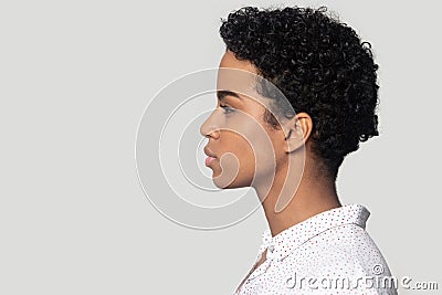 African woman profile side closeup face isolated on grey background Stock Photo