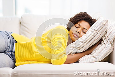 African young woman sleeping on sofa at home Stock Photo