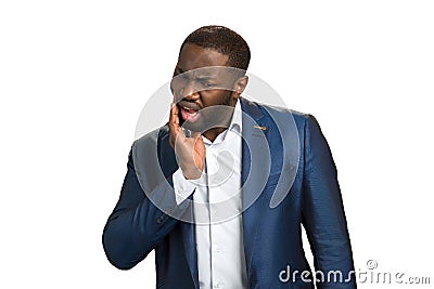 Afro american businessman feeling tooth pain. Stock Photo